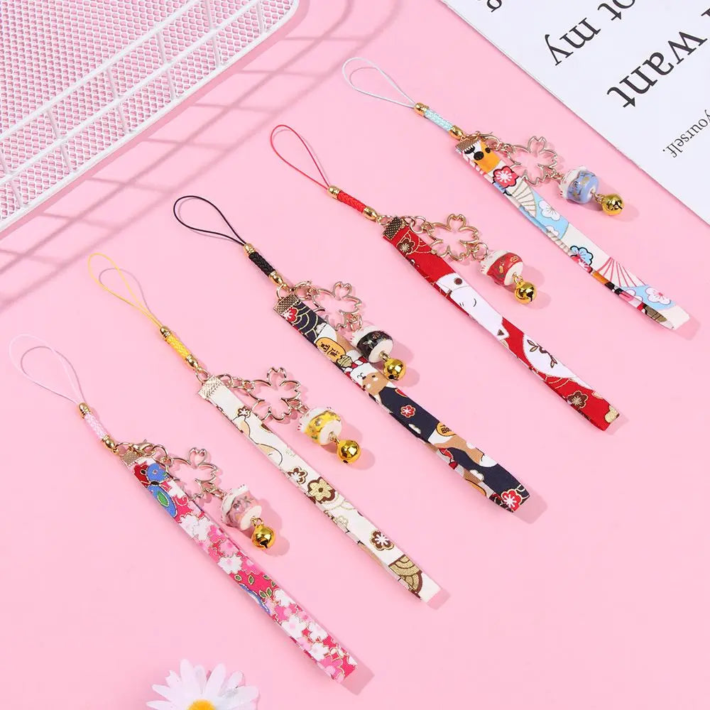Cordón colgante para teléfono estilo japonés, diseño de flores de cerezo y gato de la suerte, varios colores.