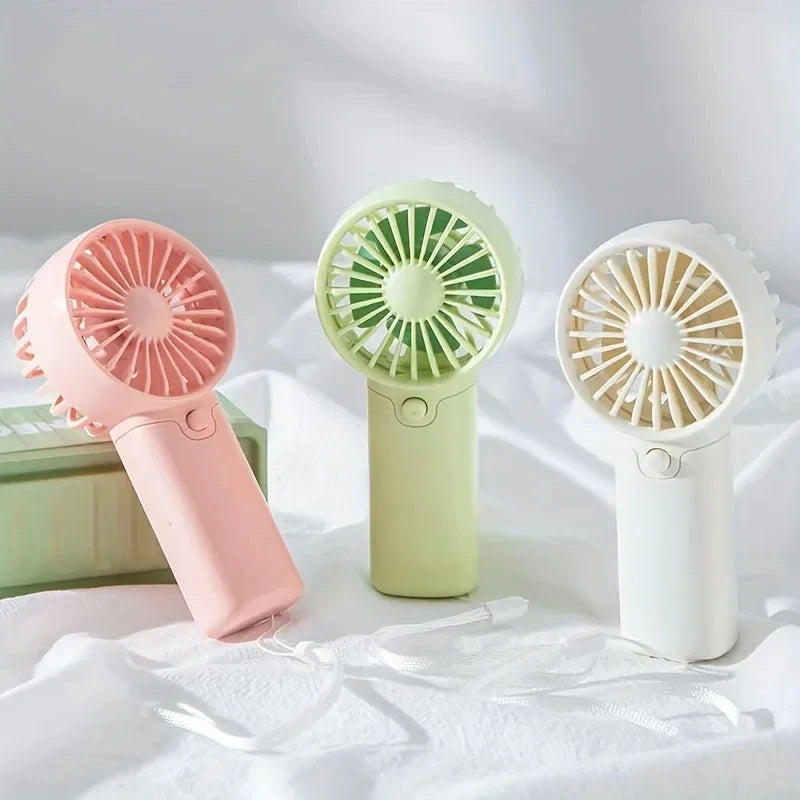 2025 lindo Mini ventilador portátil ventilador de mano ligero práctico tamaño de bolsillo bajo ruido pequeño ventilador eléctrico regalo para estudiantes ventilador al aire libre