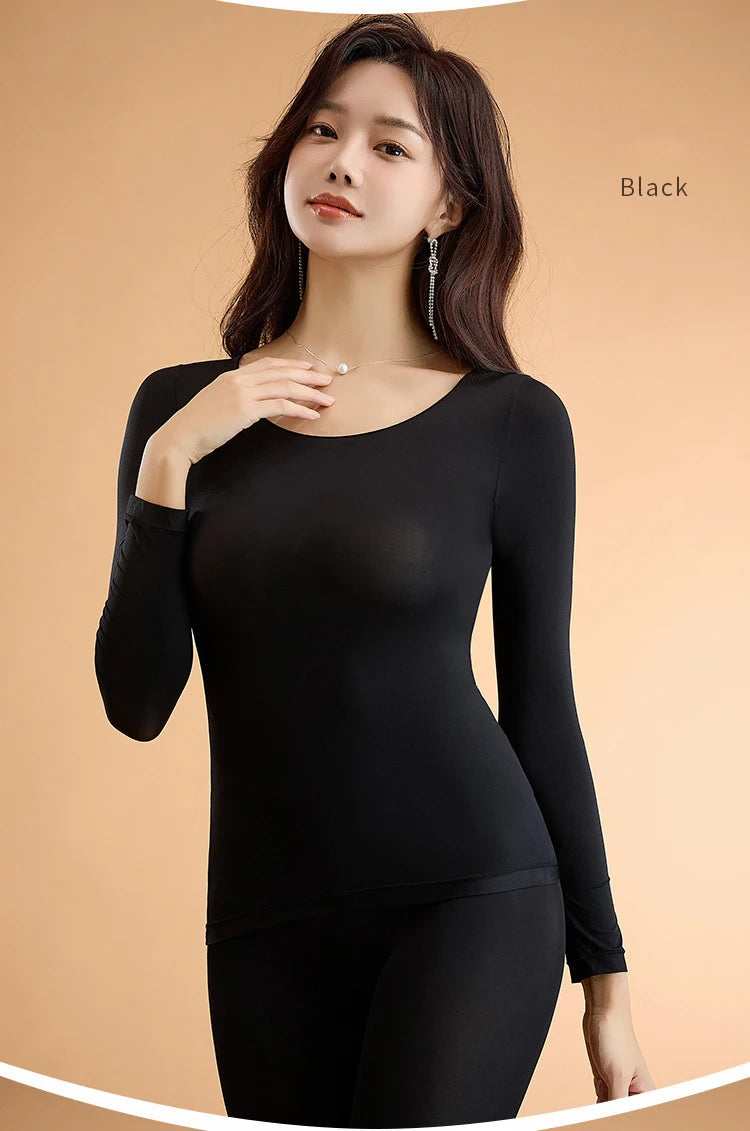 Camiseta térmica de mujer otoño invierno, manga larga, color negro, ajuste ceñido y material cómodo.