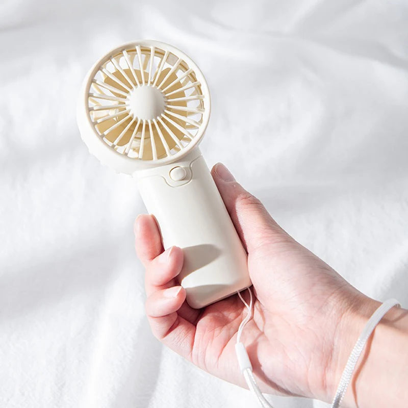 2025 lindo Mini ventilador portátil ventilador de mano ligero práctico tamaño de bolsillo bajo ruido pequeño ventilador eléctrico regalo para estudiantes ventilador al aire libre