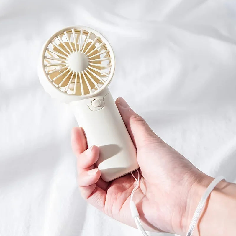 2025 lindo Mini ventilador portátil ventilador de mano ligero práctico tamaño de bolsillo bajo ruido pequeño ventilador eléctrico regalo para estudiantes ventilador al aire libre