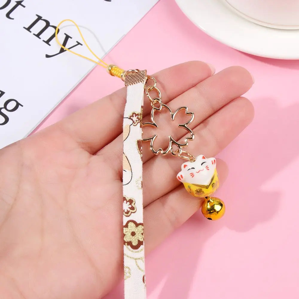 Cordón colgante para teléfono estilo japonés con gato de la suerte y flor de cerezo, diseño distintivo y atractivo.