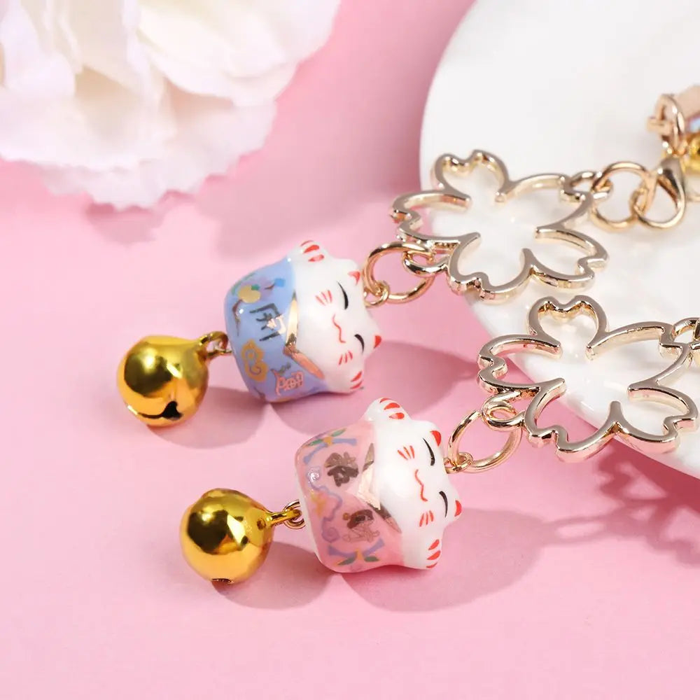 Cordón colgante para teléfono estilo japonés con campanas y flores de cerezo.